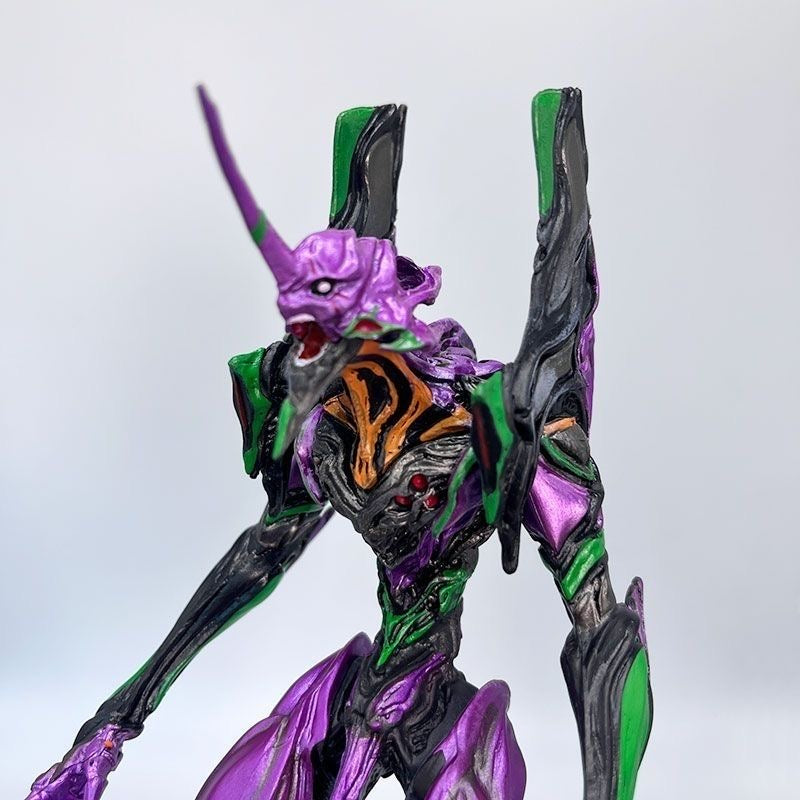 Evangelion Unit-01 figure displayed on a desk as anime room decor